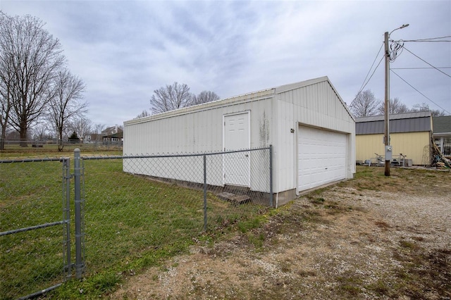 garage featuring a yard