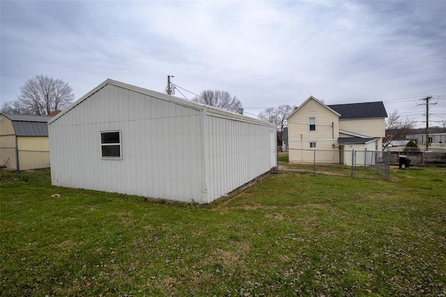 view of outbuilding with a yard