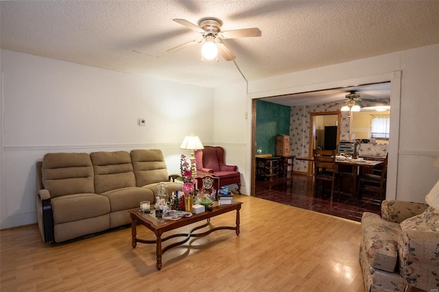 living room featuring hardwood / wood-style floors and a textured ceiling