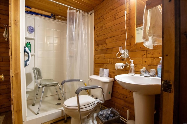 bathroom with wooden walls, toilet, and walk in shower