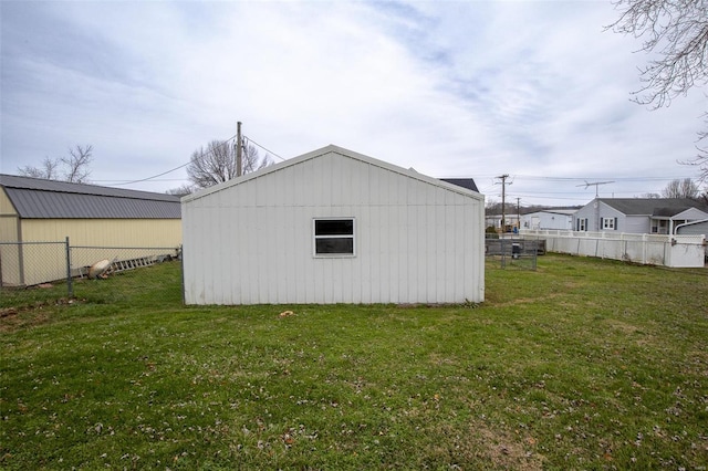 view of outbuilding featuring a yard