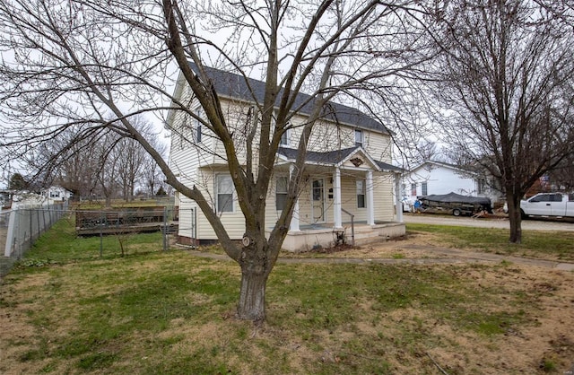 exterior space with a front lawn and a porch