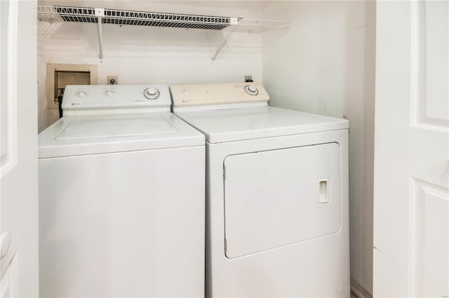 laundry area with washing machine and clothes dryer