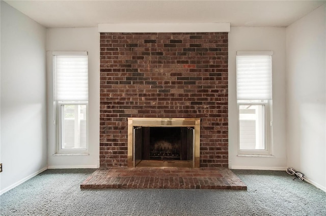 unfurnished living room featuring a fireplace and carpet