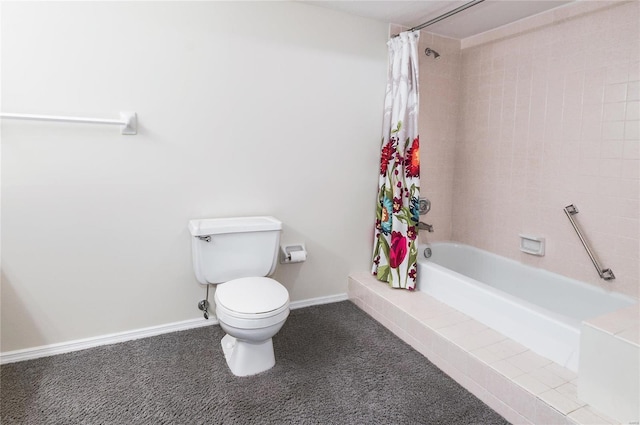 bathroom with shower / bath combo and toilet