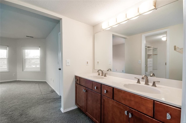 bathroom featuring vanity and a textured ceiling