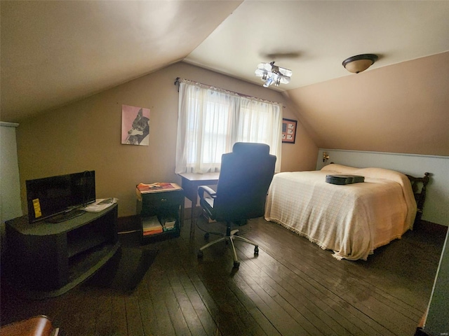 bedroom featuring hardwood / wood-style floors and vaulted ceiling