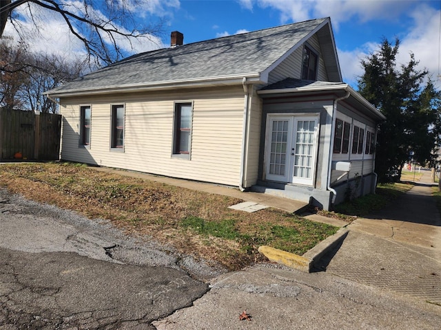 view of side of home featuring french doors