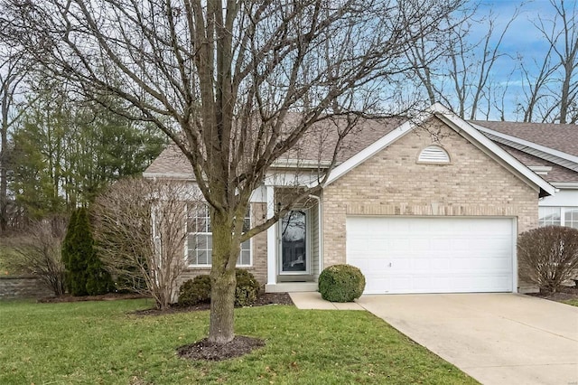 view of front of house featuring a front yard and a garage