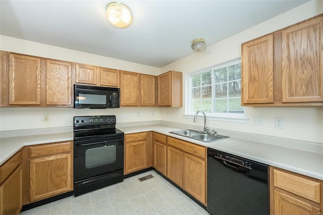 kitchen featuring black appliances and sink