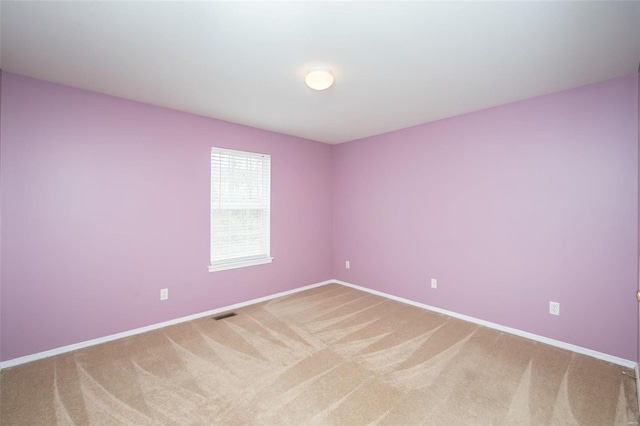 spare room with carpet floors