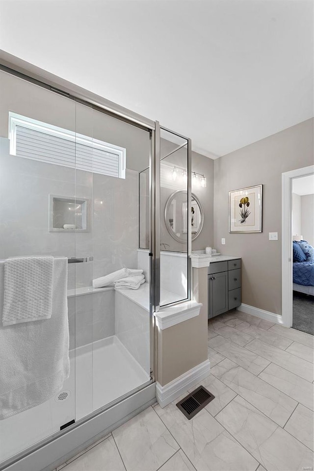 bathroom with vanity and an enclosed shower