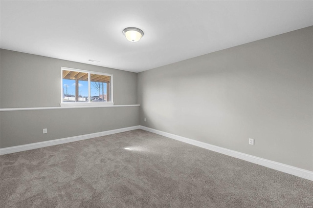 empty room featuring carpet flooring