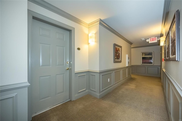 corridor with light colored carpet and ornamental molding