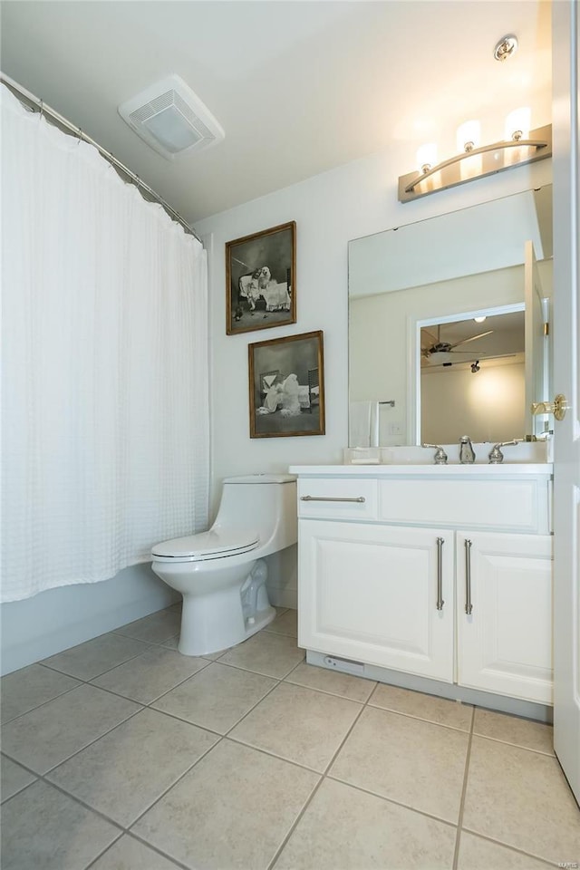 full bathroom with toilet, tile patterned flooring, shower / tub combo, and vanity