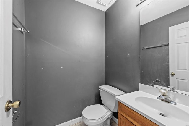 bathroom with tile patterned floors, vanity, and toilet