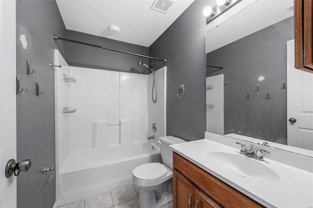 full bathroom featuring tile patterned floors, vanity, bathtub / shower combination, and toilet