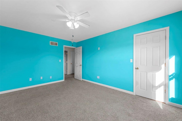 unfurnished bedroom with carpet floors and ceiling fan