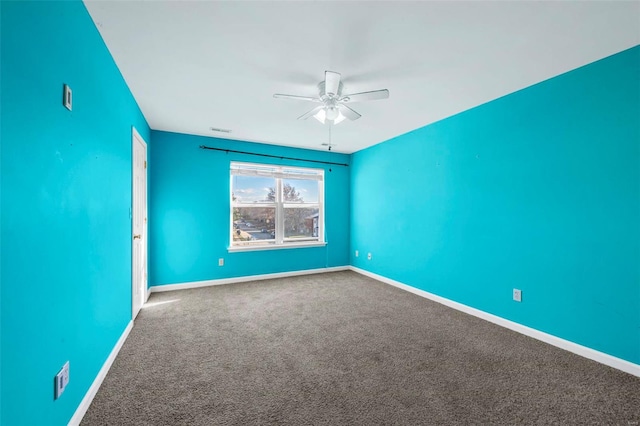 unfurnished room featuring carpet and ceiling fan