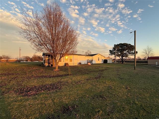 view of yard at dusk