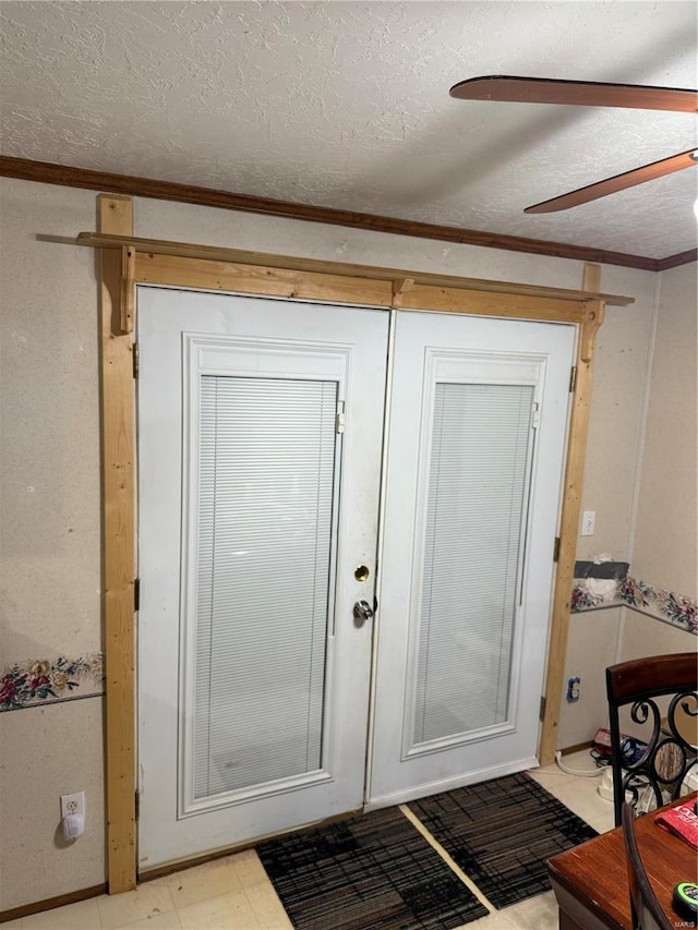 doorway to outside with ceiling fan, crown molding, and a textured ceiling