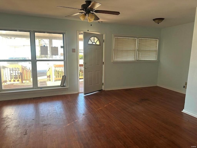 foyer entrance featuring dark hardwood / wood-style floors and ceiling fan