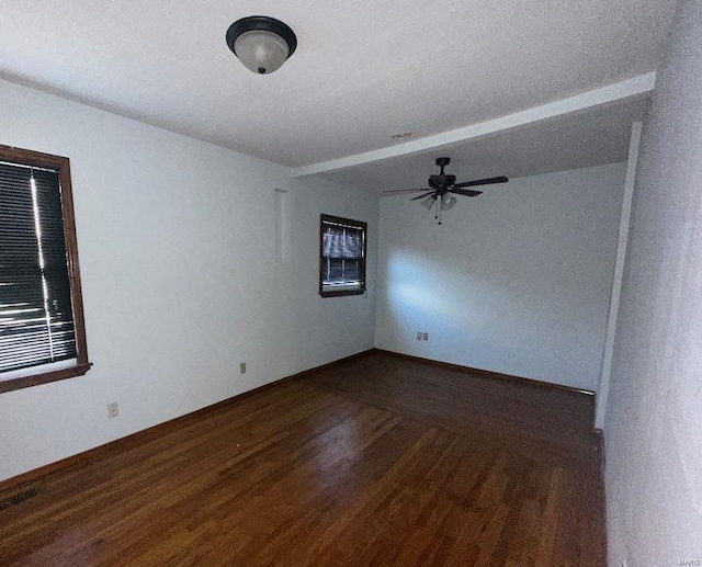 unfurnished room featuring ceiling fan and dark hardwood / wood-style floors