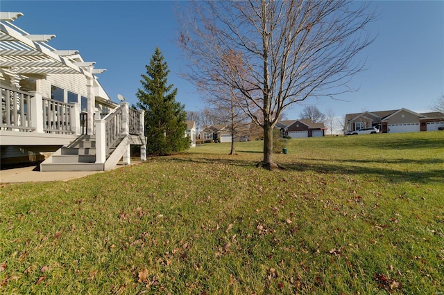 view of yard featuring a deck and a pergola