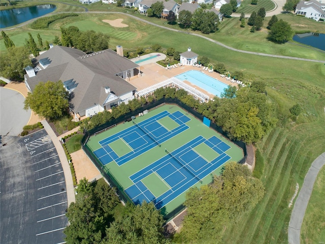 birds eye view of property with a water view