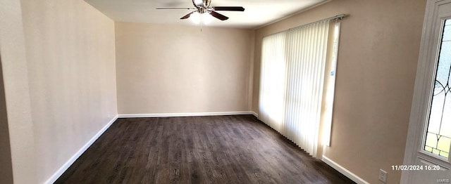 empty room with ceiling fan and dark wood-type flooring