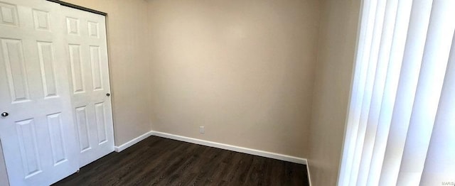 unfurnished bedroom featuring dark hardwood / wood-style floors