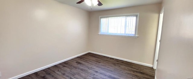 empty room featuring ceiling fan and dark hardwood / wood-style flooring