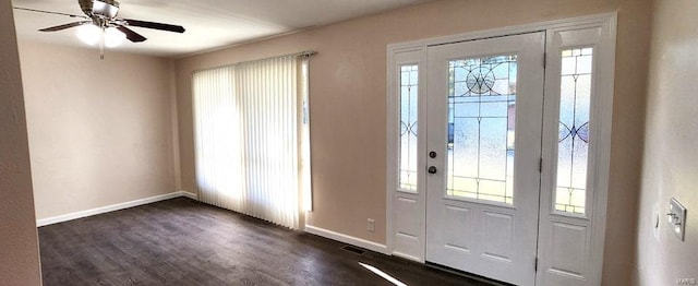 foyer entrance with a wealth of natural light, dark wood-type flooring, and ceiling fan