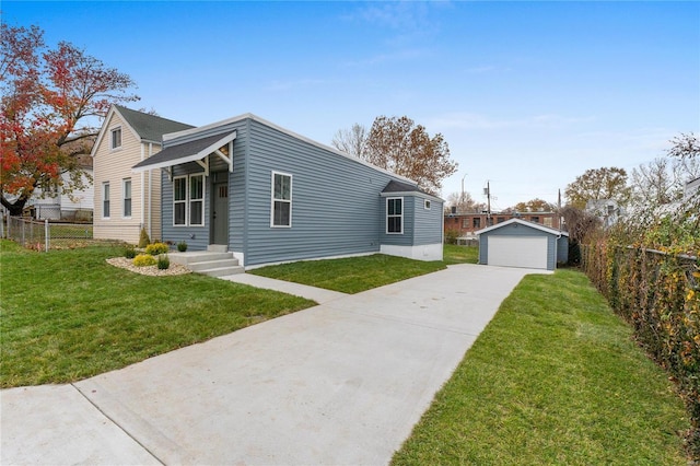 view of front of property with a garage, a front lawn, and an outdoor structure