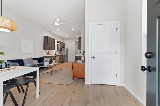 interior space featuring light hardwood / wood-style flooring and ceiling fan