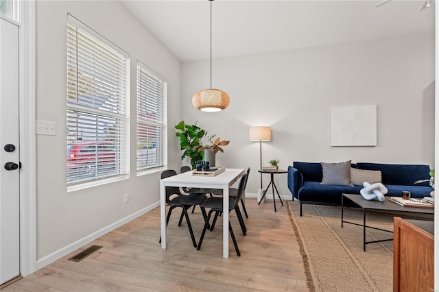 dining area featuring light wood-type flooring