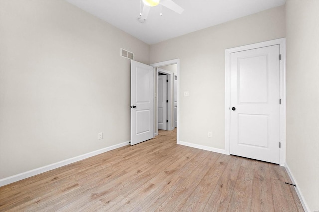 unfurnished bedroom with light wood-type flooring and ceiling fan