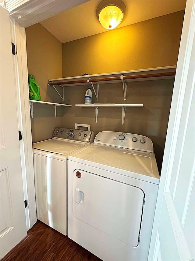 laundry room featuring washer and clothes dryer and dark wood-type flooring