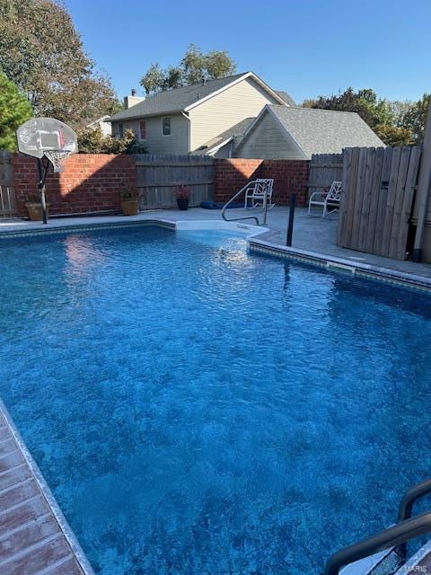 view of pool featuring a patio