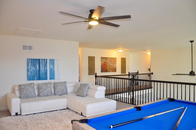 recreation room with light carpet, ceiling fan, and billiards