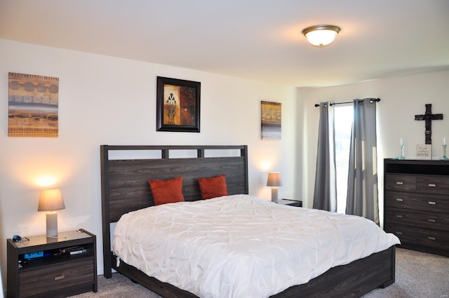 bedroom featuring light carpet