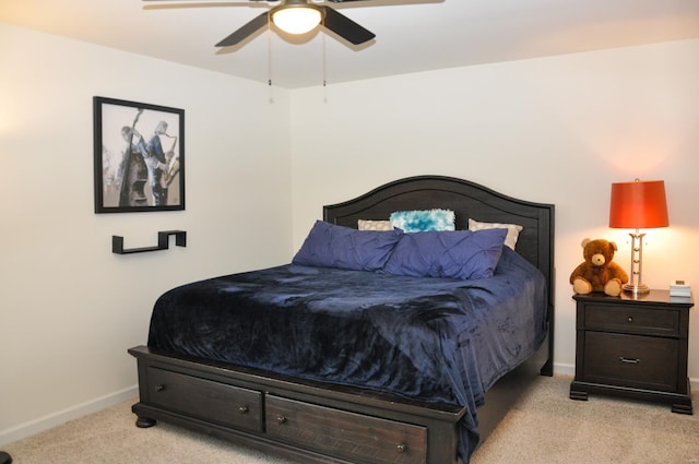 bedroom featuring ceiling fan and light carpet