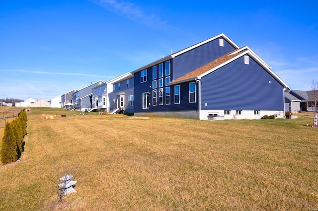 view of side of property featuring a yard