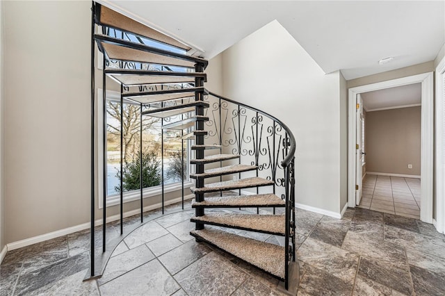 staircase with stone tile flooring and baseboards