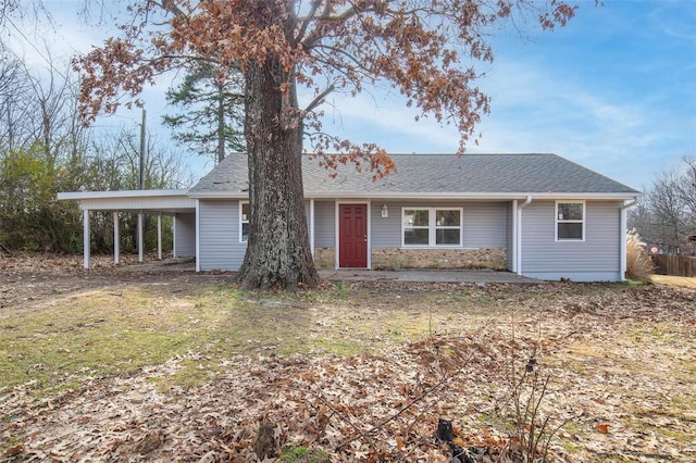 ranch-style home with a carport