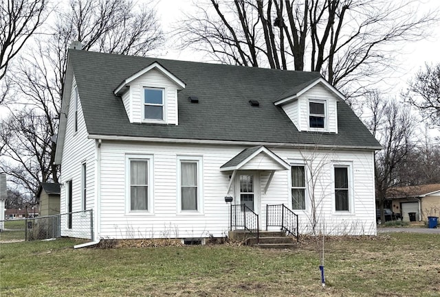 cape cod-style house featuring a front lawn