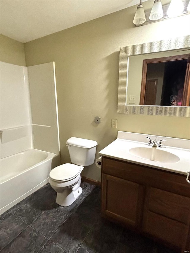 full bathroom with shower / bathing tub combination, vanity, and toilet