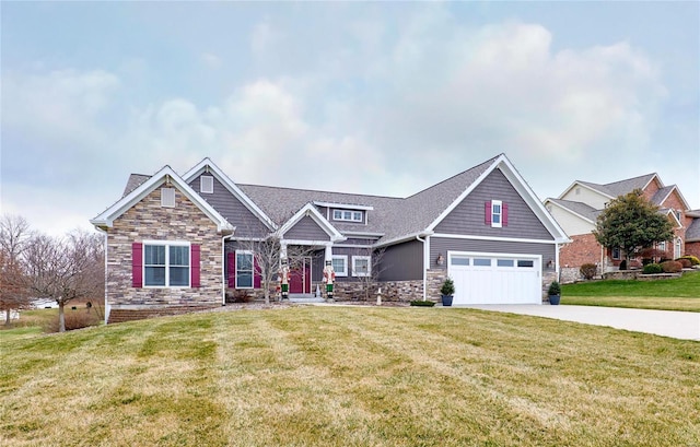 craftsman-style home featuring a garage and a front lawn