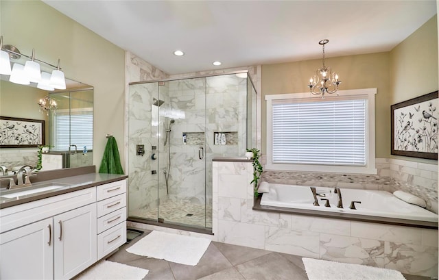 bathroom with tile patterned flooring, vanity, separate shower and tub, and an inviting chandelier