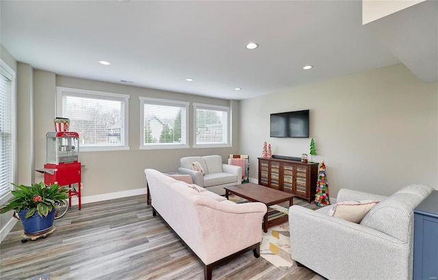 living room with light hardwood / wood-style flooring